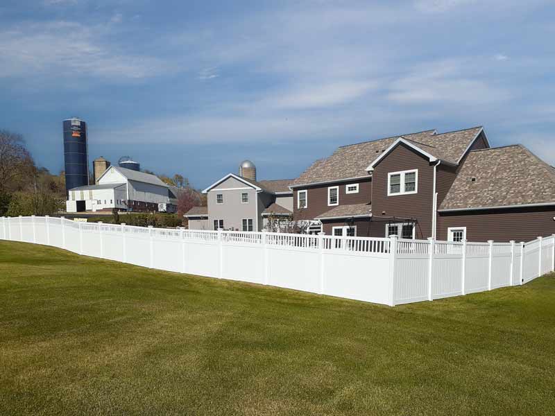 White PVC Vinyl Fence with decorate features on the top.